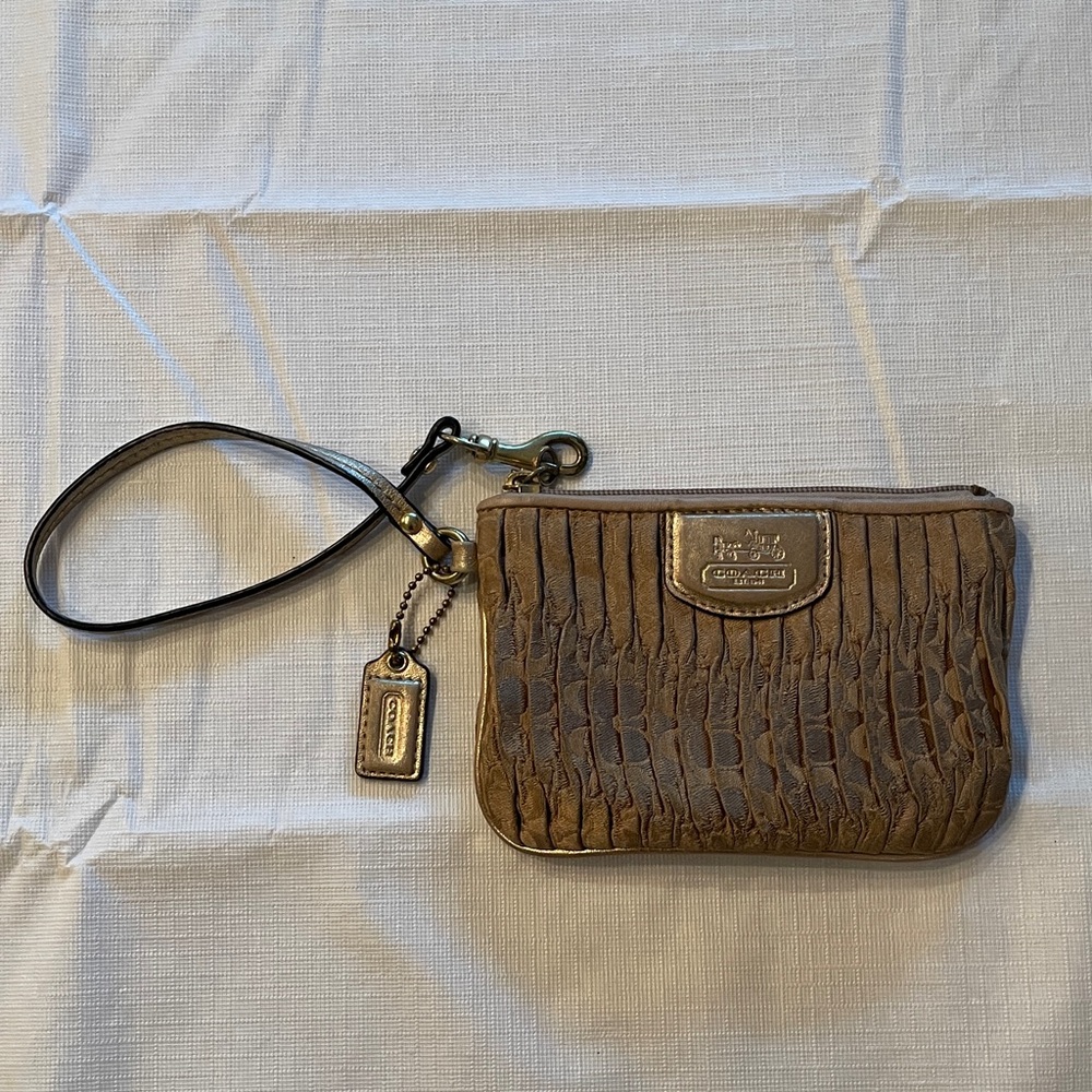 Coach Gold Textured Wristlet. Used condition